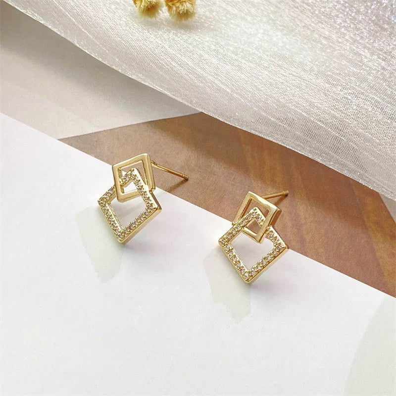 BOUCLE D'OREILLES DOUBLE GÉOMÉTRIQUE